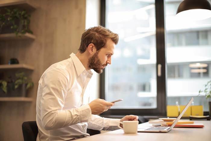 Image of Person Dialing a Mobile Phone